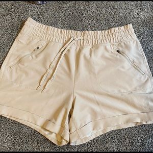 tan tangerine athletic shorts